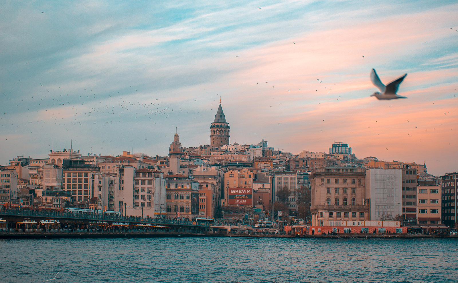 the view of istanbul from the water at sunset