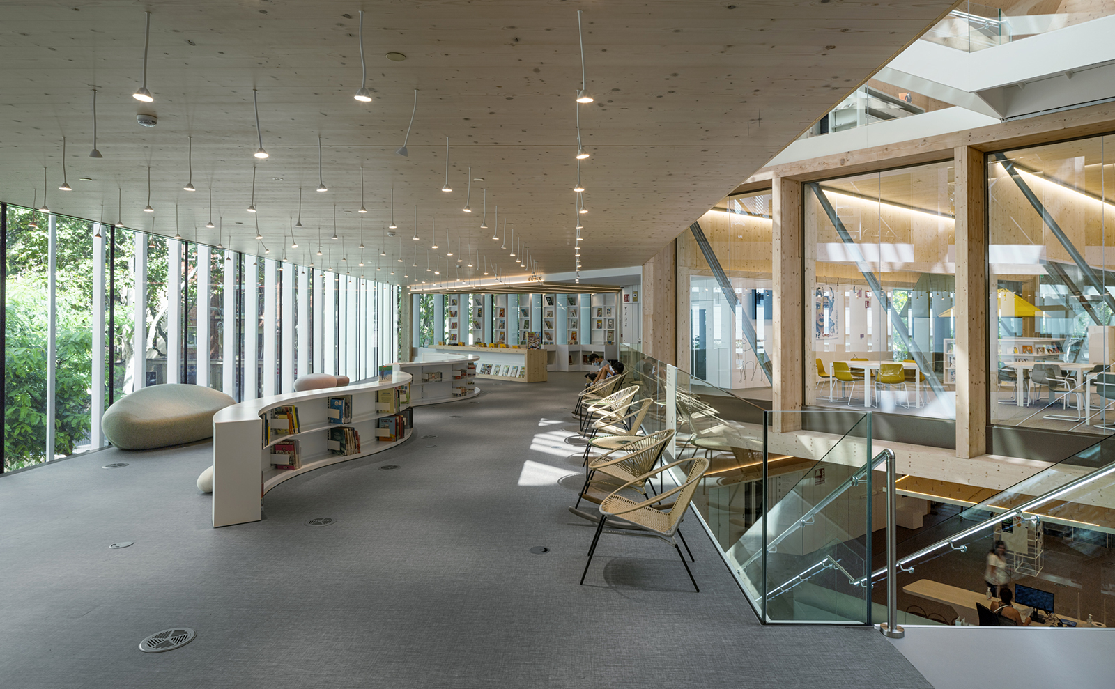 interior of library with lots of windows and curved bookshelves
