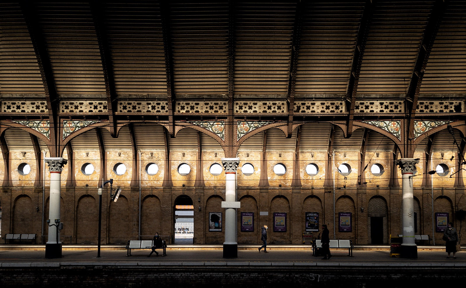 the inside of a victorian train station with vaulted ceiling