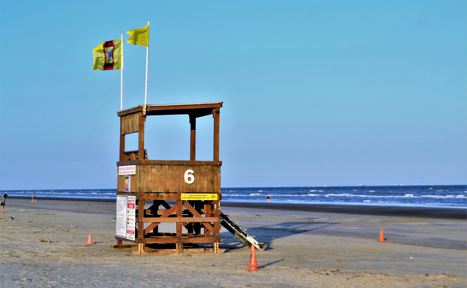 sand beach with a colorful vintage lifeguard station